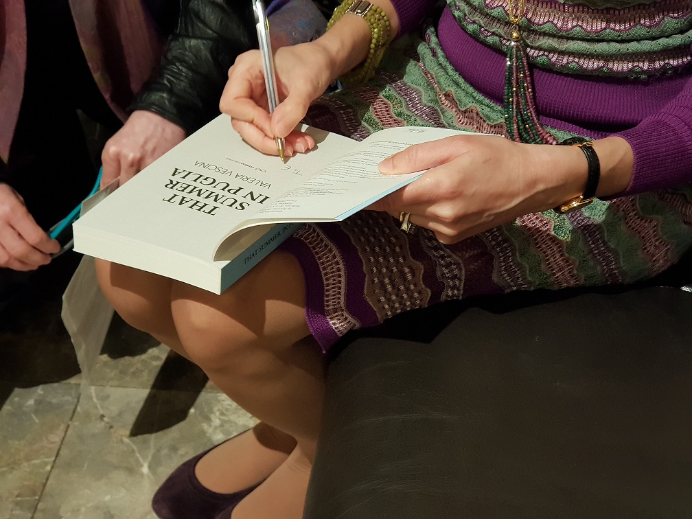 Valeria signing books